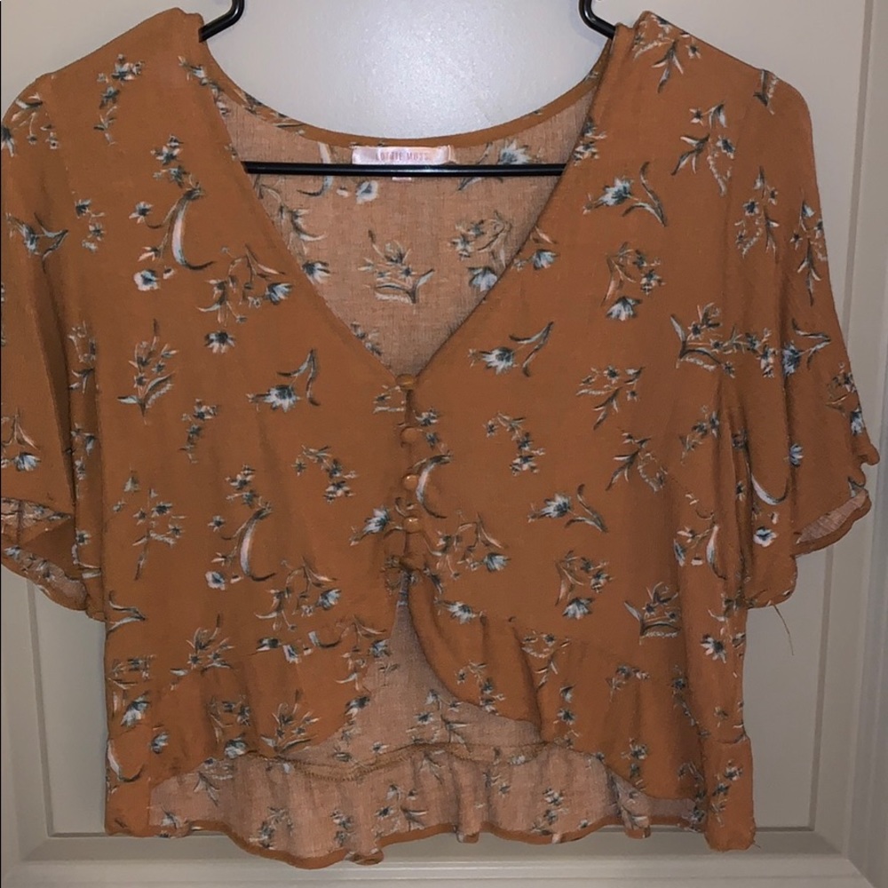 Dark yellow/gold crop top with floral patterns